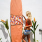 This image features a canvas surfboard cover named "Fleurieu Peninsula Sunset Orange," inspired by the stunning ocean sunsets observed on the south Australia coast. The cover is crafted from durable, waterproof canvas, designed to protect the surfboard from dings, dents, sun, sand, and surf wax.